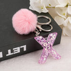 Llavero a crochet paso a paso con pompón glitter y letras doradas – Bag Charm Premium