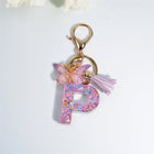 Llaveros Charms Letras A-Z con Colgante Mariposa y Borla - Accesorio Premium para Bolsos