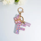 Llaveros Charms Letras A-Z con Colgante Mariposa y Borla - Accesorio Premium para Bolsos