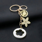 Bag Charm Premium de Trébol de 4 Hojas con Flor de Cristal - Llavero Elegante para Bolso