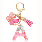 Bag Charm Personalizado: Llavero Letra Inicial Rosa con Colgante Mariposa - Accesorio Premium para B