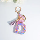 Llaveros Charms Letras A-Z con Colgante Mariposa y Borla - Accesorio Premium para Bolsos