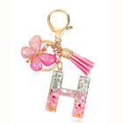Bag Charm Personalizado: Llavero Letra Inicial Rosa con Colgante Mariposa - Accesorio Premium para B