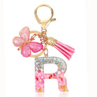Bag Charm Personalizado: Llavero Letra Inicial Rosa con Colgante Mariposa - Accesorio Premium para B