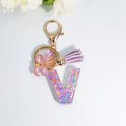 Llaveros Charms Letras A-Z con Colgante Mariposa y Borla - Accesorio Premium para Bolsos