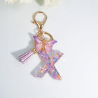 Llaveros Charms Letras A-Z con Colgante Mariposa y Borla - Accesorio Premium para Bolsos