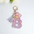 Llaveros Charms Letras A-Z con Colgante Mariposa y Borla - Accesorio Premium para Bolsos