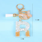 Llaveros Originales para Coche - Elegancia Blanca con Iniciales y Borla de Mariposa