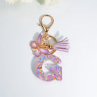 Llaveros Charms Letras A-Z con Colgante Mariposa y Borla - Accesorio Premium para Bolsos