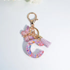 Llaveros Charms Letras A-Z con Colgante Mariposa y Borla - Accesorio Premium para Bolsos