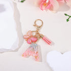 Bag Charm Personalizado: Llavero Letra Inicial Rosa con Colgante Mariposa - Accesorio Premium para B