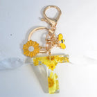 Llavero para moteros con inicial personalizada - Girasol amarillo fashion premium