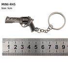 Mini Cámara Llavero Metálico - Colección de Armas Anime Premium para Fiestas y Mochileros