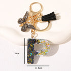 Llavero con Foto Personalizado Mariposa Negra y Borla - Regalo Único para Mamá