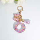 Llaveros Charms Letras A-Z con Colgante Mariposa y Borla - Accesorio Premium para Bolsos