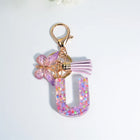 Llaveros Charms Letras A-Z con Colgante Mariposa y Borla - Accesorio Premium para Bolsos
