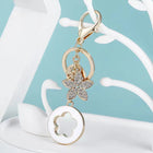Bag Charm Premium de Trébol de 4 Hojas con Flor de Cristal - Llavero Elegante para Bolso