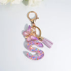 Llaveros Charms Letras A-Z con Colgante Mariposa y Borla - Accesorio Premium para Bolsos