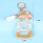 Llaveros Originales para Coche - Elegancia Blanca con Iniciales y Borla de Mariposa