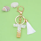 Llaveros Charms Personalizados con Iniciales - Letras Doradas y Borla Blanca para Bolsos