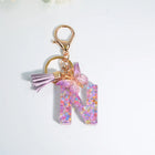 Llaveros Charms Letras A-Z con Colgante Mariposa y Borla - Accesorio Premium para Bolsos