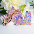 Llaveros Charms Letras A-Z con Colgante Mariposa y Borla - Accesorio Premium para Bolsos