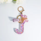 Llaveros Charms Letras A-Z con Colgante Mariposa y Borla - Accesorio Premium para Bolsos