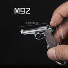 Llavero para Moteros 2025 Pistola Táctica Modelo Aleación 1:4 con Borlas y Caja Transparente - Regal