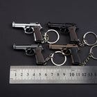 Llavero para Moteros 2025 Pistola Táctica Modelo Aleación 1:4 con Borlas y Caja Transparente - Regal
