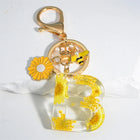 Llavero para moteros con inicial personalizada - Girasol amarillo fashion premium