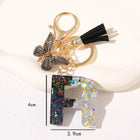 Llavero con Foto Personalizado Mariposa Negra y Borla - Regalo Único para Mamá