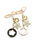 Bag Charm Premium de Trébol de 4 Hojas con Flor de Cristal - Llavero Elegante para Bolso