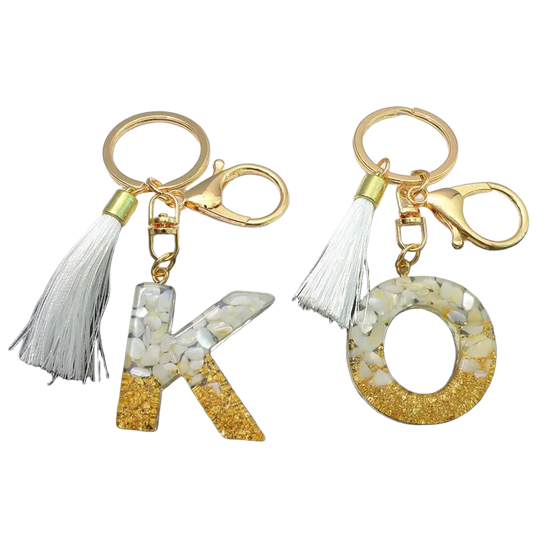 Llaveros Charms Personalizados con Iniciales - Letras Doradas y Borla Blanca para Bolsos